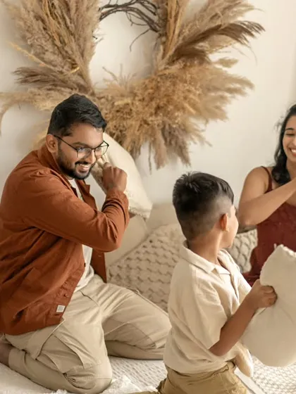 Forget stiff poses. I want your session to be fun. A family pillow fight is the perfect way to bring out genuine smiles and playful energy, creating memories of laughter and chaos that are uniquely yours.