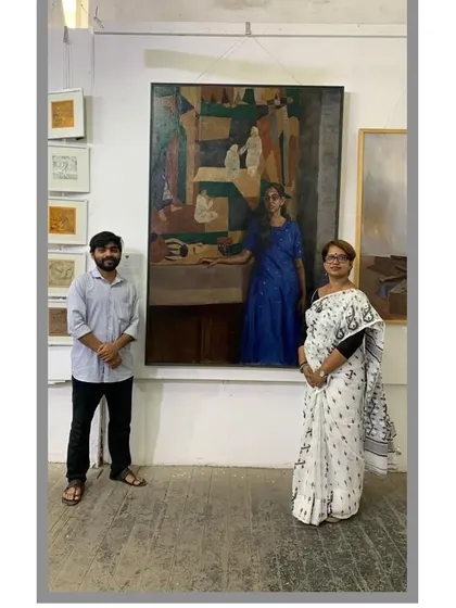 Discussing my work with a teacher during the exhibition.