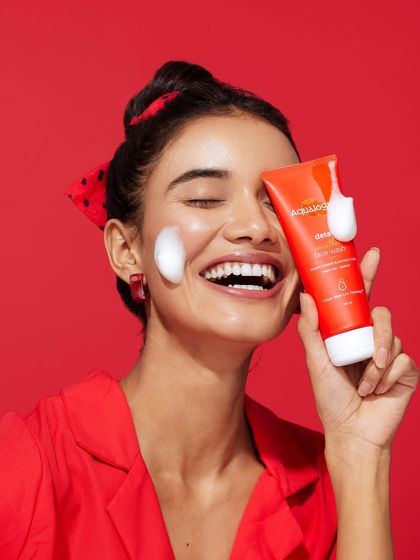 The styling for this shot was all about fun and freshness. A simple red top and a polka-dot bandana create a retro-inspired, joyful vibe.
