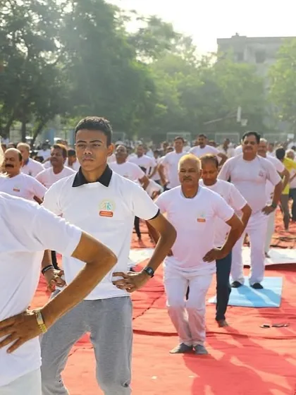 Participants engaged in simple warm-up exercises. Yoga is for everybody, regardless of age or fitness level. The key is to start where you are and practice consistently.