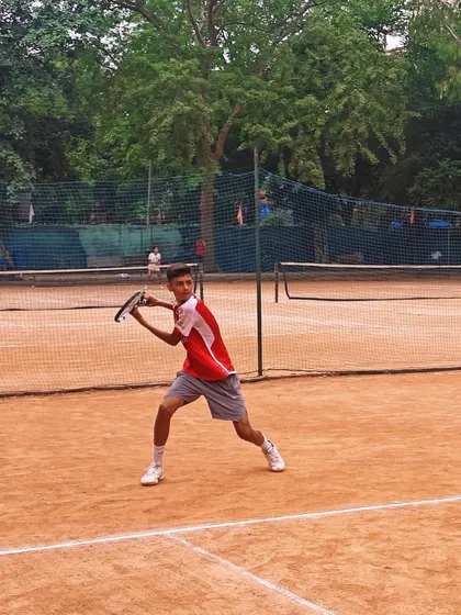 Action from a competitive match on one of our clay courts. Our players are trained to adapt and excel on all surfaces, whether it's the slow grind of clay or the fast pace of a hard court.