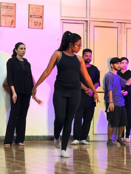 Students moving together in sync during a practice session. The energy in the room is always so supportive and collaborative.