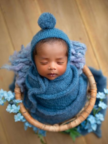 Adding a little pom-pom hat to the blue wrap setup gives it a whole new, adorable look.