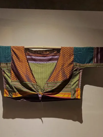 A beautiful garment made from traditional 'Khunn' fabric, displayed at the 'Pampa' exhibition in Hampi. This showcases how heritage textiles can be used to create contemporary silhouettes.