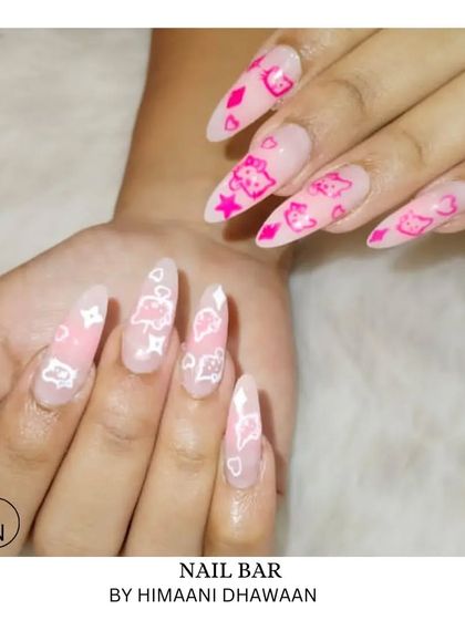 For the lovers of all things cute. This set features pink and white character art on long, pointed nail extensions.