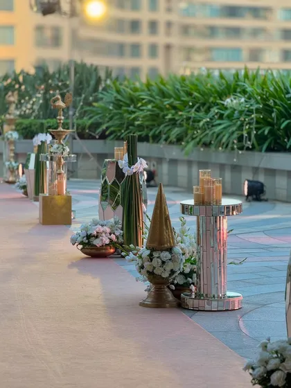 More angles from the super chic rooftop celebration in Mumbai. The decor combines modern elements with classic florals, all set against a stunning city skyline.