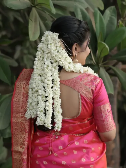 A view of the traditional South Indian bridal braid adorned with fresh jasmine flowers (gajra).