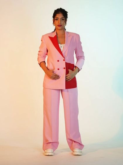 A pink and red color-block suit that's all about making a bold statement. It's a fun and modern take on power dressing.