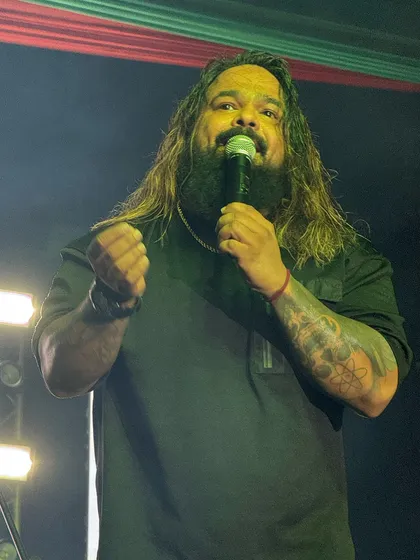 Another intense shot of our frontman, connecting with the crowd and living in the moment.