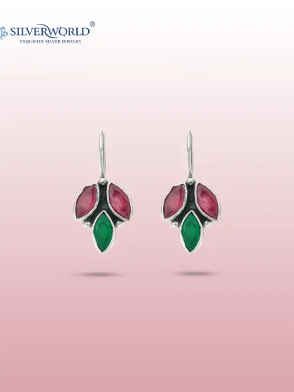 These unique drop earrings are crafted with faceted ruby-red and emerald-green stones in a leaf-like design. The sterling silver setting provides a beautiful contrast to the rich colors.
