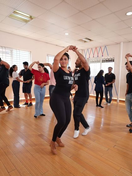 A wide shot of our class, showing students practicing a turn pattern. You can see the focus and the fun happening all at once.