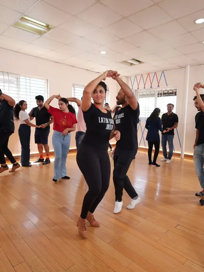 A wide shot of our class, showing students practicing a turn pattern. You can see the focus and the fun happening all at once.