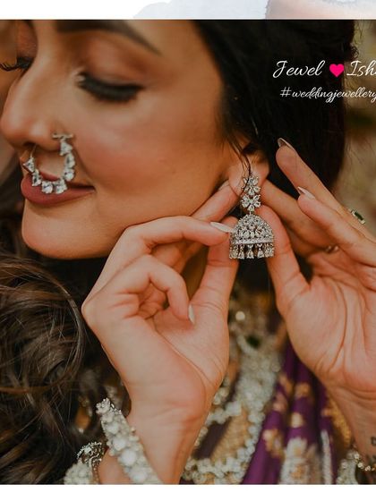 A close-up of the diamond jhumka and nath. These pieces are designed to be lightweight and comfortable while still providing the sparkle and elegance a bride desires.