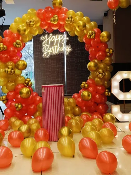 A classic birthday balloon ring in red and gold. This is a great example of a basic yet beautiful setup that can be customized for any age.