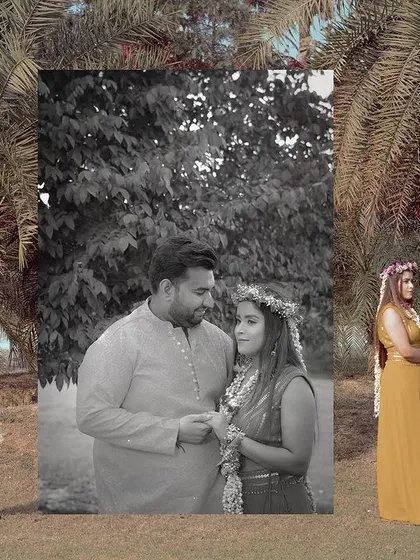 A creative and artistic shot from a Haldi ceremony, with a black and white portrait of the couple framed by the colorful reality of the event.