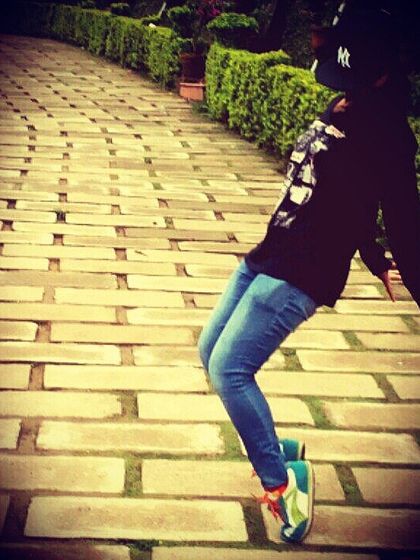 A raw and fearless hip-hop-inspired pose. This reflects the confidence and attitude that dance can bring out in anyone.