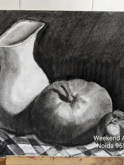 Mastering light and shadow is a fundamental skill. This is a still life composition done in charcoal, focusing on creating depth, texture, and form using only black and white tones.