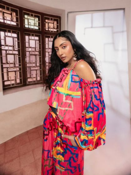 An off-the-shoulder top from the same Advait collection, showcasing its versatility. The styling here is soft and feminine, focusing on the beautiful print and the relaxed fit of the garment.