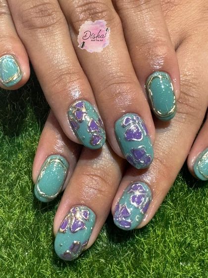 A unique and artistic design with a mix of teal, purple, and gold accents.