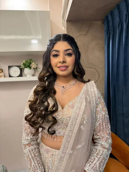 A full view of this stunning engagement lehenga, paired with a modern glam makeup look that is perfect for an evening celebration.