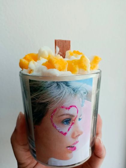 A custom popcorn candle I made for a Taylor Swift fan. This shows how I can personalize my creations to match any theme or interest.