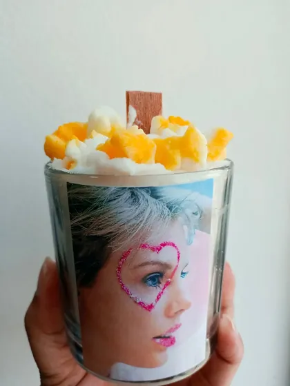 A customized popcorn candle made for a Taylor Swift fan, showing my ability to create unique, personalized items.