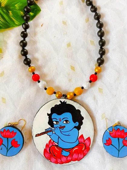 A second look at my Baal Gopal (young Krishna) necklace set. The serene expression and the vibrant colors of the lotus make this a truly heartwarming piece of wearable art.
