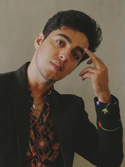 A close-up shot of Gagan Arora, showcasing the patterned shirt from Banana Club and delicate jewelry I used to complete his look.