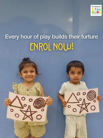 Every hour of play builds their future. These two proud artists are showing off their work, a result of a creative session that also built their confidence.