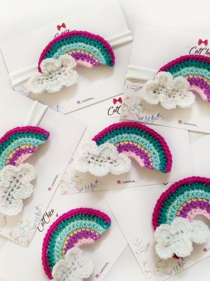 Our crochet rainbow headbands are perfect for newborns and toddlers. This design features a colorful rainbow with a fluffy white cloud on a soft band.