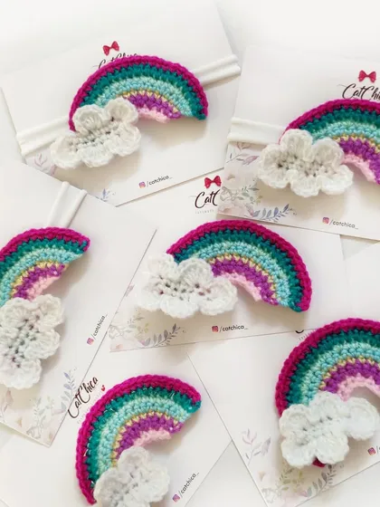 Our crochet rainbow headbands are perfect for newborns and toddlers. This design features a colorful rainbow with a fluffy white cloud on a soft band.