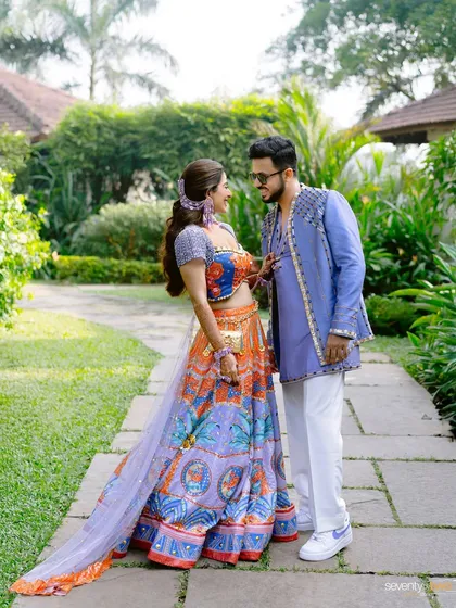The couple shares a look of love, their colorful and quirky Mehendi outfits perfectly capturing the fun vibe of their Goa celebration.