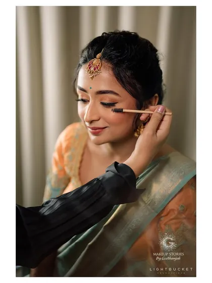 A behind the scenes moment of putting the final touches on Harshitha for her engagement. My process is collaborative and detailed, ensuring every element from the eyeshadow blend to the hair is perfect before you step out.