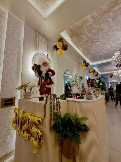 Our reception desk, decorated for the holiday season. We believe in creating a warm and welcoming first impression the moment you step into the salon.