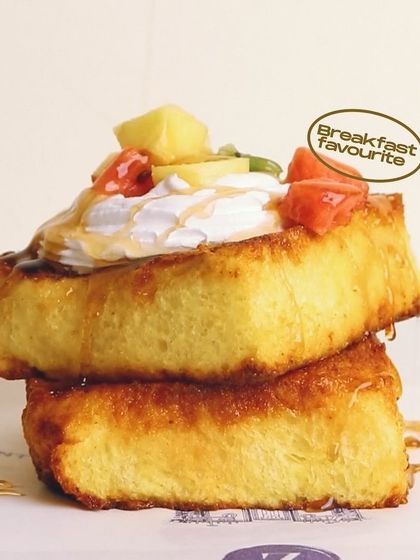 A beautiful stack of my French Toast, or Pain Perdu, crowned with fresh fruits. It's a breakfast favorite that's as lovely to look at as it is to eat.