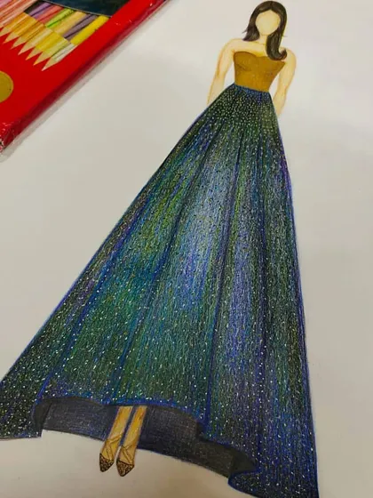 This illustration shows a student's design for a glamorous evening gown with a glittering, high-low skirt. Students practice rendering different fabric effects, like the sparkle on this skirt, to make their sketches look realistic and appealing.