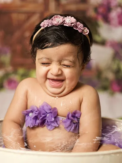 The purest giggle! Our water splash and milk bath sessions are so much fun for the babies. This little one couldn't stop laughing, and we were so happy to capture that genuine, unscripted moment of delight.