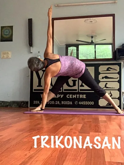 Another view of Trikonasana, showing the rotation of the torso towards the ceiling. I teach the subtle alignments of this powerful pose.
