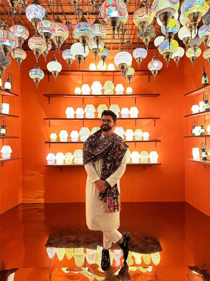 Another angle of the shawl and kurta look, showing how it complements the warm, ambient lighting.
