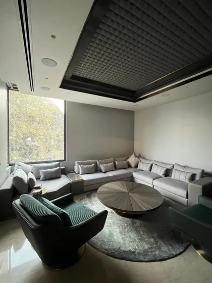 This room is a journey through geometric design, where Art Deco inspiration meets modern innovation. The quilted ceiling is an unexpected touch of luxury, adding texture and glamour.
