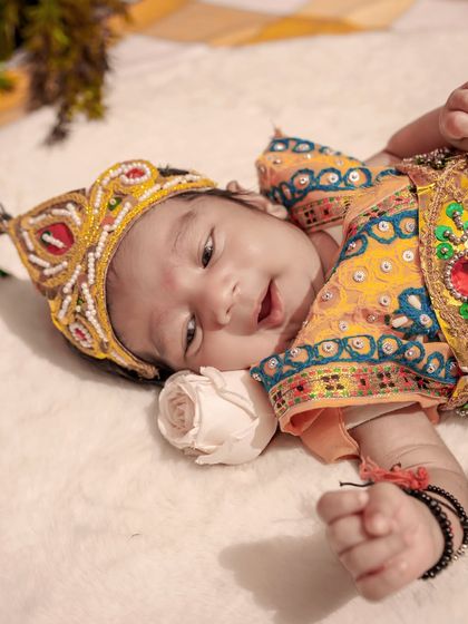 A quiet moment with our little Krishna resting peacefully. We ensure the baby is always comfortable and safe, allowing us to capture these serene and gentle portraits.