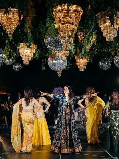 The whole family group strikes a pose during their choreographed dance. I love creating these big, inclusive numbers that get everyone involved in the celebration.