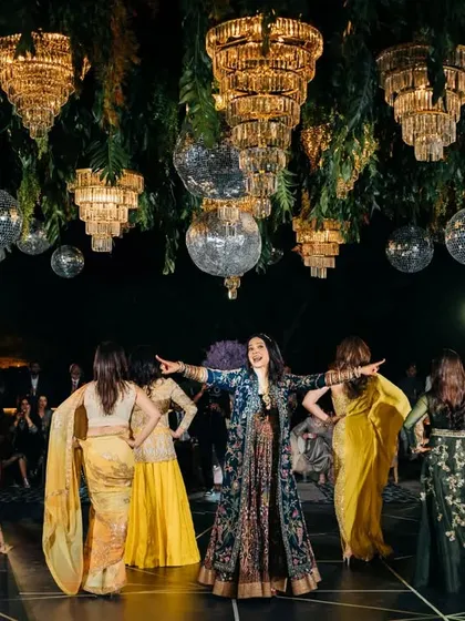 The whole family group strikes a pose during their choreographed dance. I love creating these big, inclusive numbers that get everyone involved in the celebration.