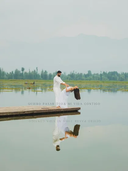 A serene and romantic pre-wedding moment captured on a wooden dock at Dal Lake, Kashmir. We travel with our couples to create beautiful narratives in stunning locations before their big day.