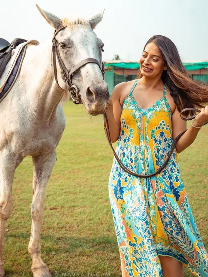 A candid, joyful moment between a model and a white horse. My open fields are perfect for capturing natural light and spontaneous interactions.