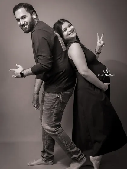 A playful and happy moment between the couple, captured in a classic black and white style. Their fun poses and genuine smiles make this a joyful and memorable shot.