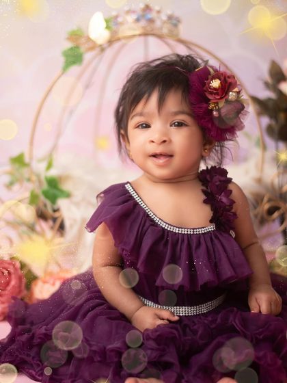 A close-up portrait from the princess session. The rich purple dress and floral hairpiece make her look so royal. I love capturing these sweet, gentle expressions.