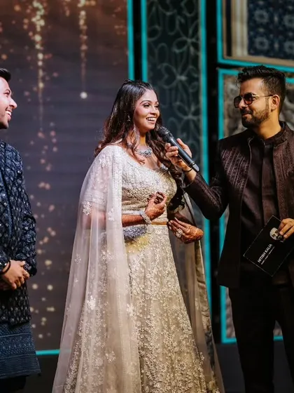 Engaging with the bride on stage during her Sangeet. I make sure the couple is always at the center of the celebration.