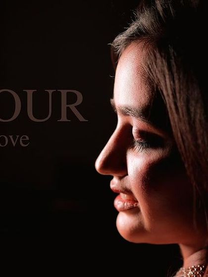 A beautiful profile shot with artistic lighting, showcasing the clean lines and soft finish of the engagement makeup.