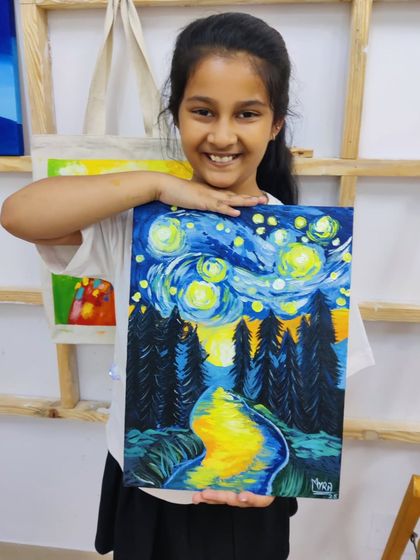 A young student recreates Van Gogh's "Starry Night," learning about impressionistic style and bold color application.